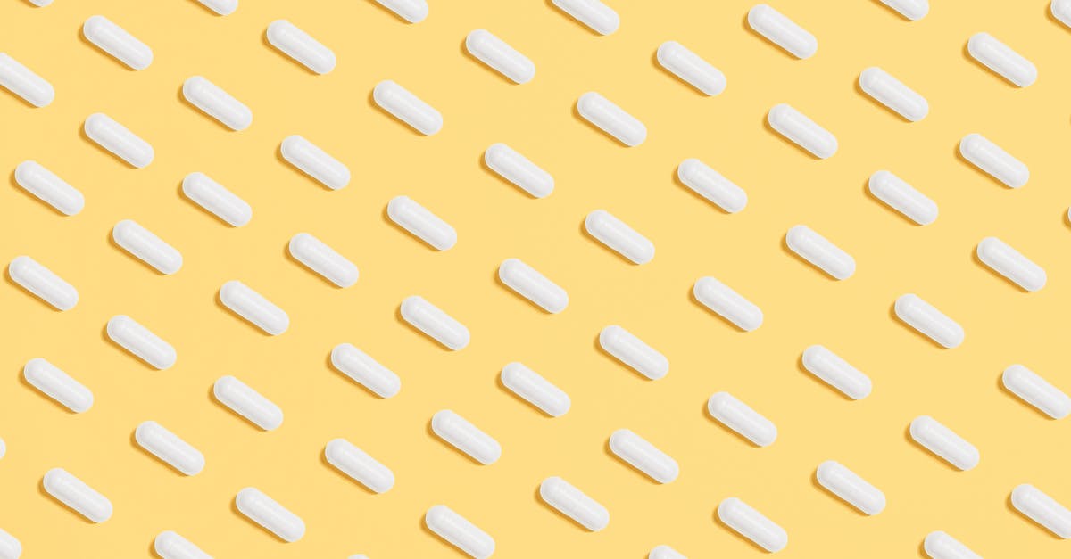 How many milliliters is a "pinch?" - White Capsules on Yellow Background