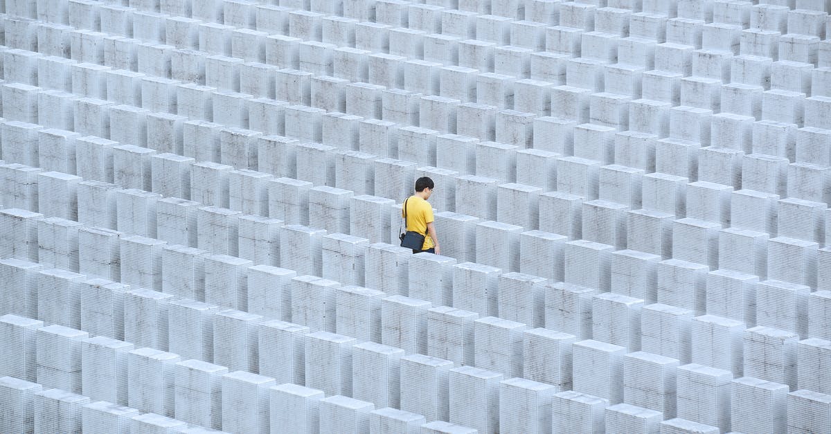 How many people does one rabbit feed? - Person in Yellow Jacket Walking on Gray Concrete Pavement How many people does one rabbit feed? - Person in Yellow Jacket Walking on Gray Concrete Pavement