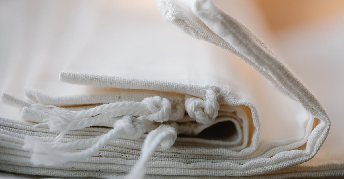 How many times can you reuse bones to make broth? - Pile of folded white cotton bags with ropes made of ecological cloth placed on table in light room on blurred background How many times can you reuse bones to make broth? - Pile of folded white cotton bags with ropes made of ecological cloth placed on table in light room on blurred background