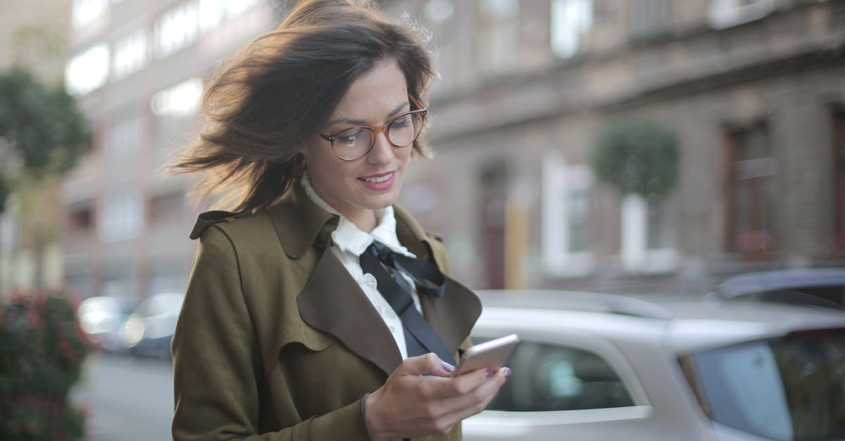How much acid to use for stabilizing meringue? - Stylish adult female using smartphone on street