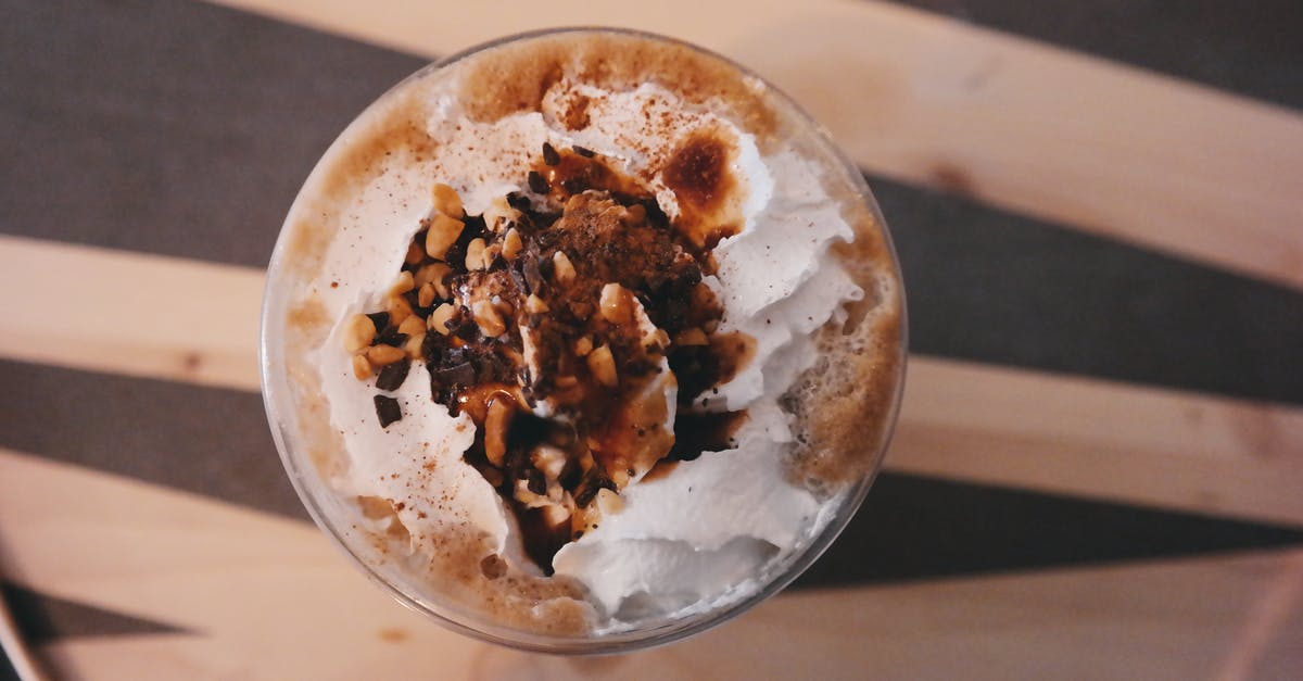 How much does a cup of hazelnuts weigh? - Flat-lay Photography of Dessert Inside of Glass Cup