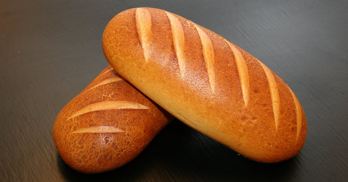 How much does a tuppenny loaf weigh? - Two Brown Baked Breads on Table How much does a tuppenny loaf weigh? - Two Brown Baked Breads on Table