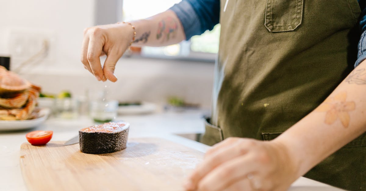 How much salt does fish in brine absorb? - Unrecognizable Female Hand Sprinkling Salt on Fish Slice How much salt does fish in brine absorb? - Unrecognizable Female Hand Sprinkling Salt on Fish Slice
