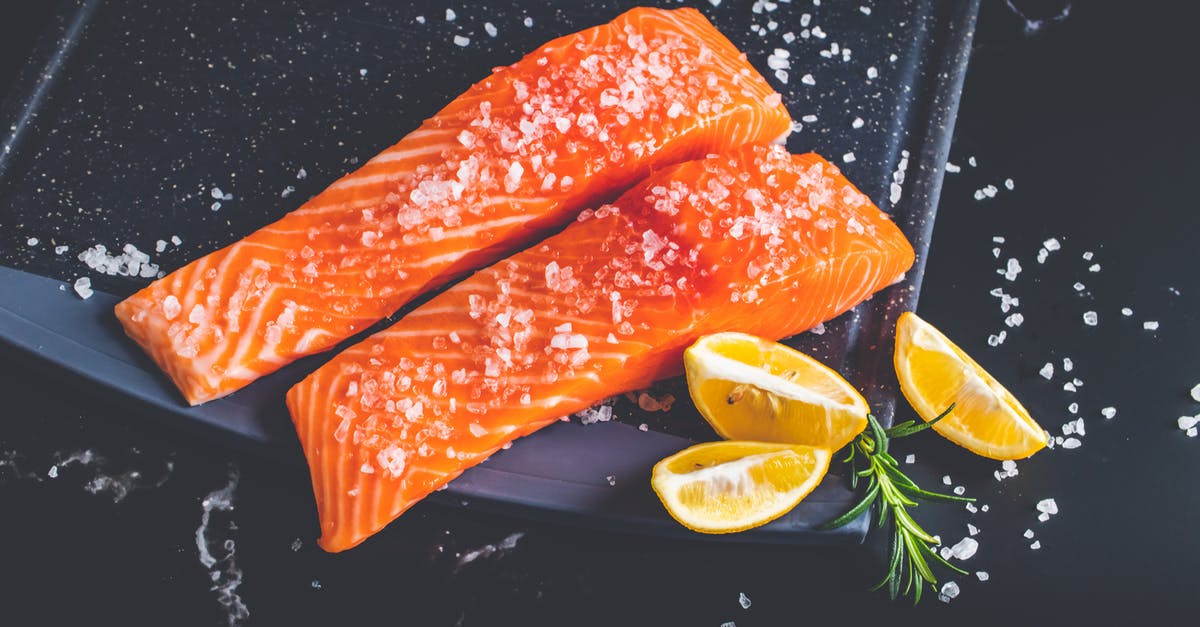 How much salt does fish in brine absorb? - Raw Pieces of Salmon with Salt and Lemon Wedges on a Baking Tray How much salt does fish in brine absorb? - Raw Pieces of Salmon with Salt and Lemon Wedges on a Baking Tray