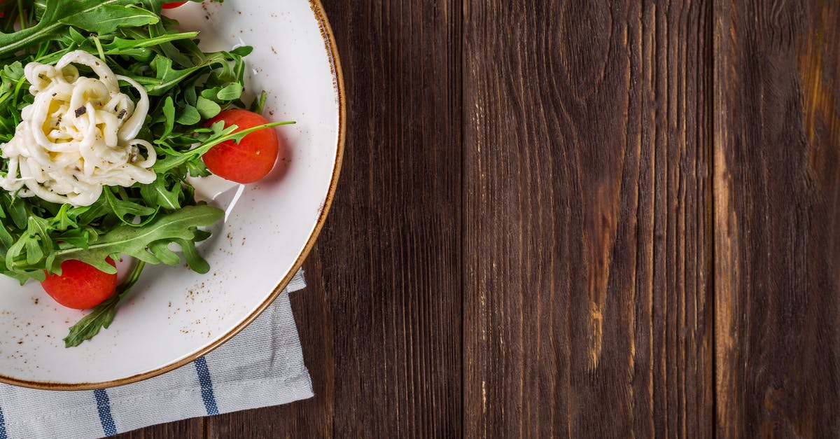 How much salt should I put in a vegetable stew? - Close-up of Salad on Table