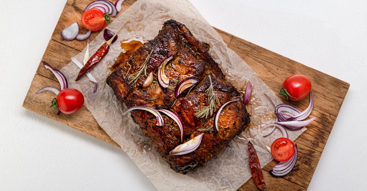 How should chuck roast be grilled to maximize tenderness? - Cooked Meat With Herbs and Spices on a Wooden Board How should chuck roast be grilled to maximize tenderness? - Cooked Meat With Herbs and Spices on a Wooden Board