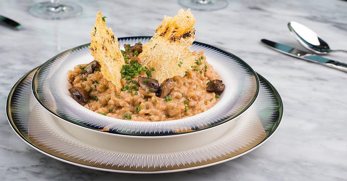 How should I prepare Risotto - Brown and Yellow Dish on White Ceramic Round Plate How should I prepare Risotto - Brown and Yellow Dish on White Ceramic Round Plate