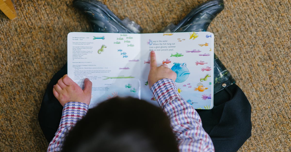 How should I read a thermometer when it's got an extra indicator line? - Photo of a Boy Reading Book How should I read a thermometer when it's got an extra indicator line? - Photo of a Boy Reading Book