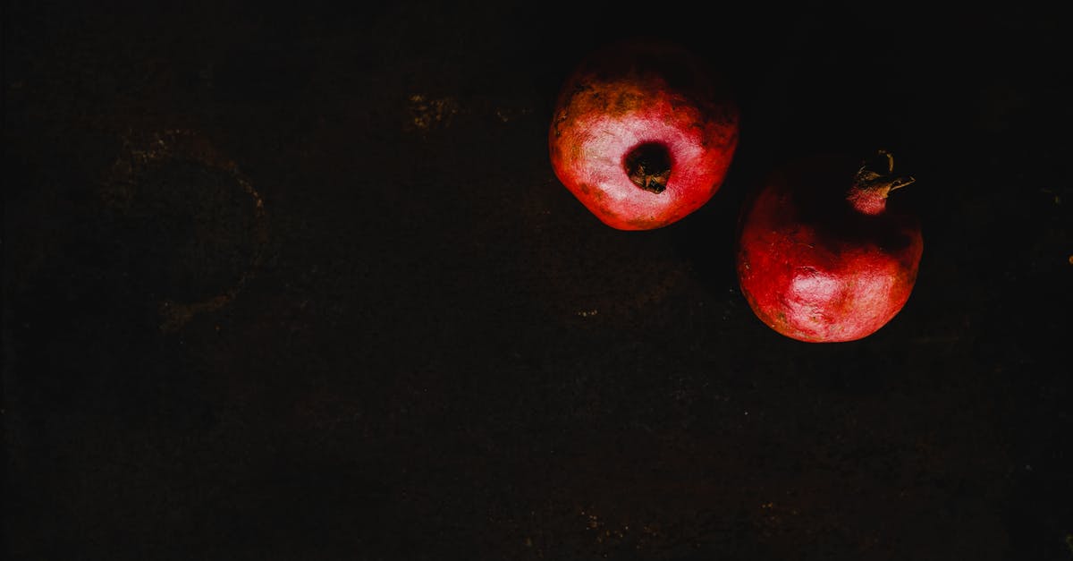 How should pomegranates be stored? - Pomegranates on Black Background How should pomegranates be stored? - Pomegranates on Black Background