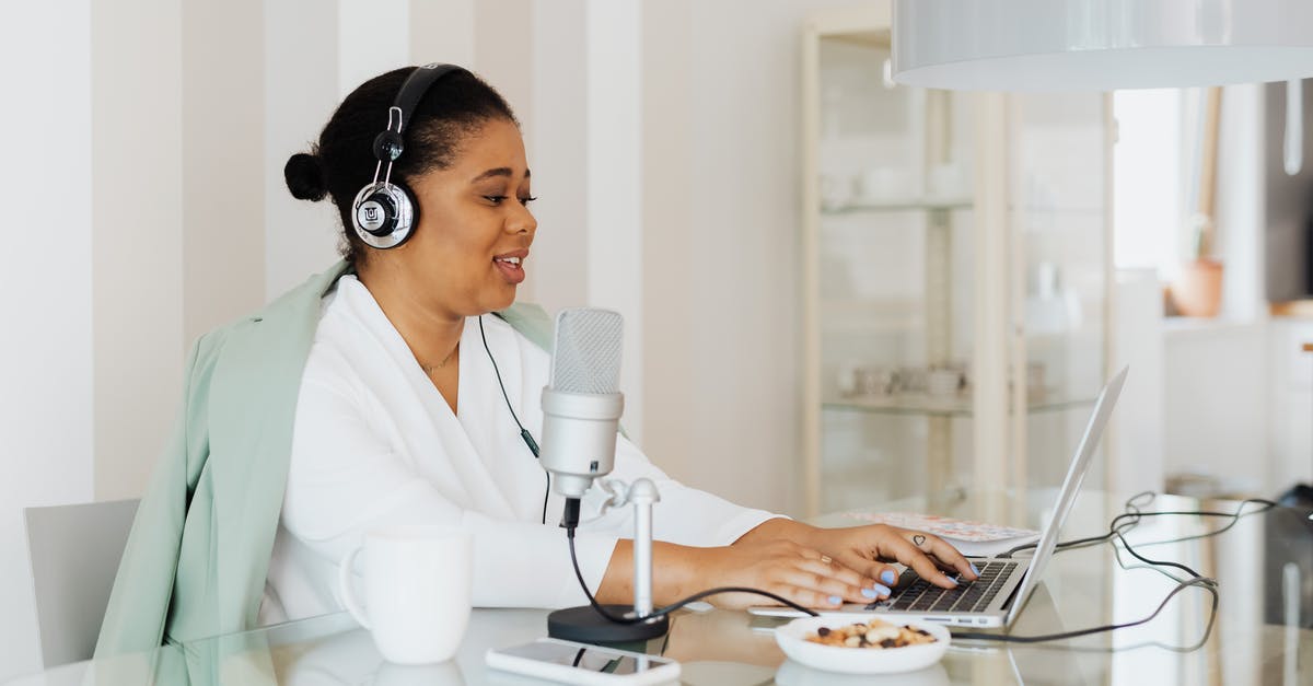 How should Viennese coffee be taken? - Woman Sitting Behind a Desk Wearing Headphones and Using a Microphone and LaptopĀ How should Viennese coffee be taken? - Woman Sitting Behind a Desk Wearing Headphones and Using a Microphone and LaptopĀ