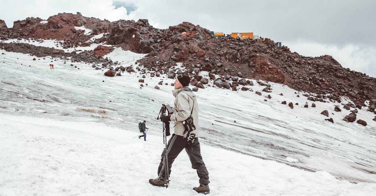 How to achieve a flexible consistency on ice cream? (photos attached) - Full body of male traveler in warm outerwear walking with trekking sticks on snowy mountain ridge in daytime How to achieve a flexible consistency on ice cream? (photos attached) - Full body of male traveler in warm outerwear walking with trekking sticks on snowy mountain ridge in daytime