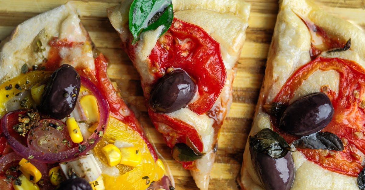 How to add creaminess to cooked corn chowder; mine is too thick? - Top view of pizza with tomato and olive on thick dough served on wooden board with stripes How to add creaminess to cooked corn chowder; mine is too thick? - Top view of pizza with tomato and olive on thick dough served on wooden board with stripes