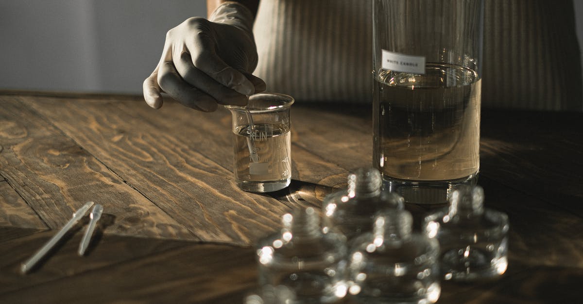 How to add savor to a squash and grain mix? - Crop anonymous female in latex gloves making fluid for perfume among glass jars on wooden table How to add savor to a squash and grain mix? - Crop anonymous female in latex gloves making fluid for perfume among glass jars on wooden table