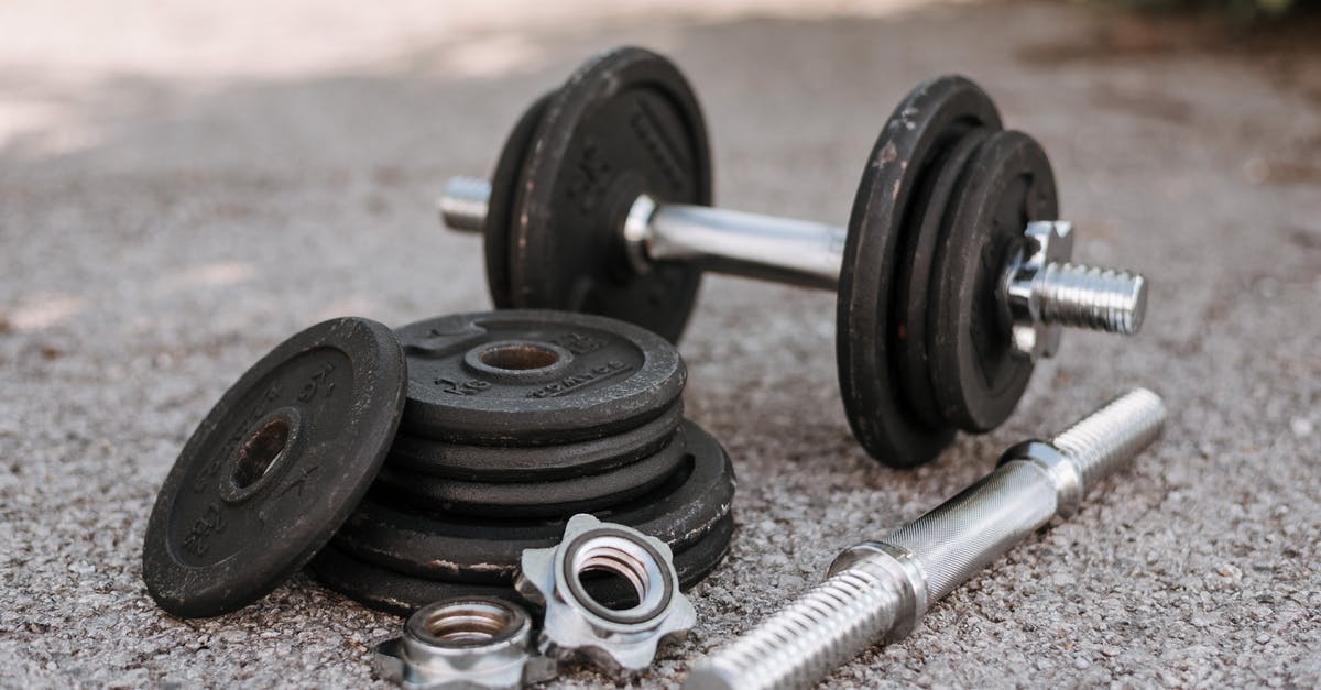 How to adjust stewing time for different weights of meat? - Heavy adjustable dumbbell near cast iron plates and hexagonal collars with stainless steel bar on pavement How to adjust stewing time for different weights of meat? - Heavy adjustable dumbbell near cast iron plates and hexagonal collars with stainless steel bar on pavement