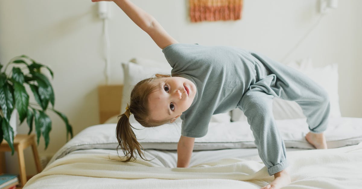 How to balance the spiciness in any kind of dishes - Adorable little girl having fun on bed at home How to balance the spiciness in any kind of dishes - Adorable little girl having fun on bed at home