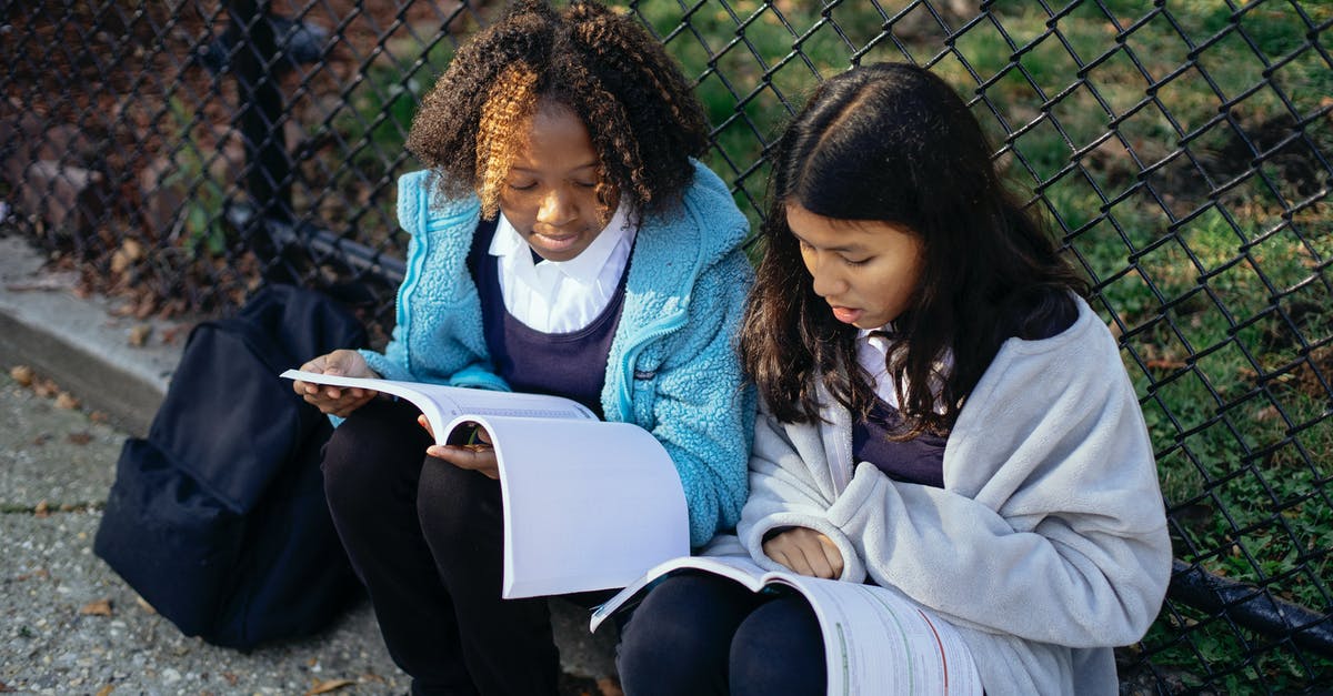 How to best prepare Sukimono - From above concentrated multiracial girls classmates reading article in textbooks while sitting together on ground near net fence in autumn park How to best prepare Sukimono - From above concentrated multiracial girls classmates reading article in textbooks while sitting together on ground near net fence in autumn park