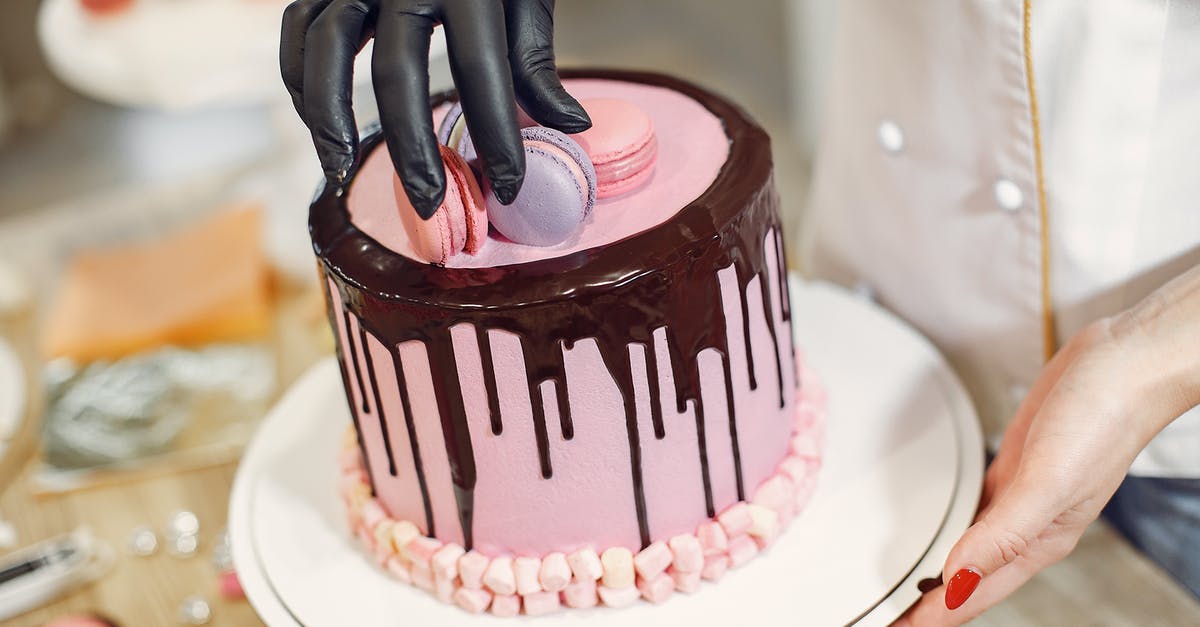 How to best store cocoa powder? - From above crop anonymous woman arranging macaroons on top of cake with chocolate drips while working in pastry store How to best store cocoa powder? - From above crop anonymous woman arranging macaroons on top of cake with chocolate drips while working in pastry store