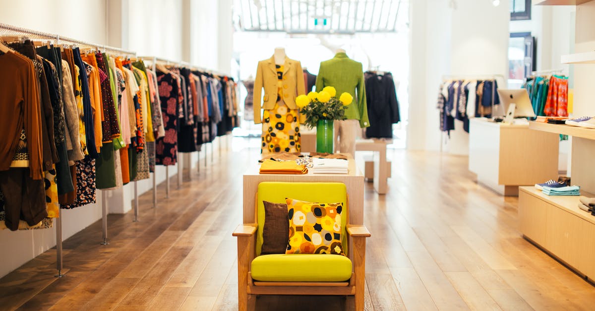 How to buy a molcajete and/or paellera - Interior of modern fashion store with stylish colorful clothes handing on rack in daytime How to buy a molcajete and/or paellera - Interior of modern fashion store with stylish colorful clothes handing on rack in daytime