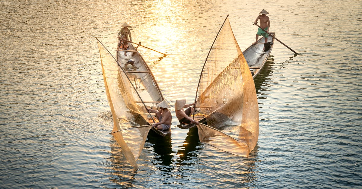 How to catch culture out of yogurt? - Unrecognizable fishermen catching fish from boats with nets in ocean How to catch culture out of yogurt? - Unrecognizable fishermen catching fish from boats with nets in ocean