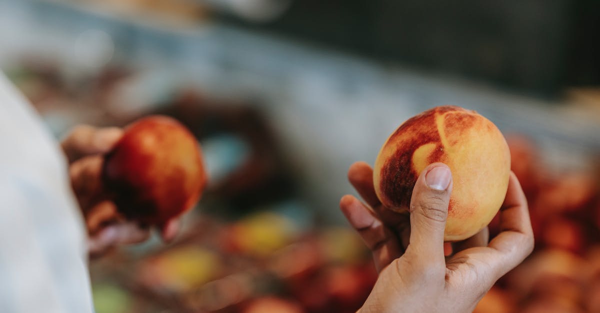 How to choose fresh, ripe (hot) jalapeños? - Crop faceless male choosing peaches in food market How to choose fresh, ripe (hot) jalapeños? - Crop faceless male choosing peaches in food market