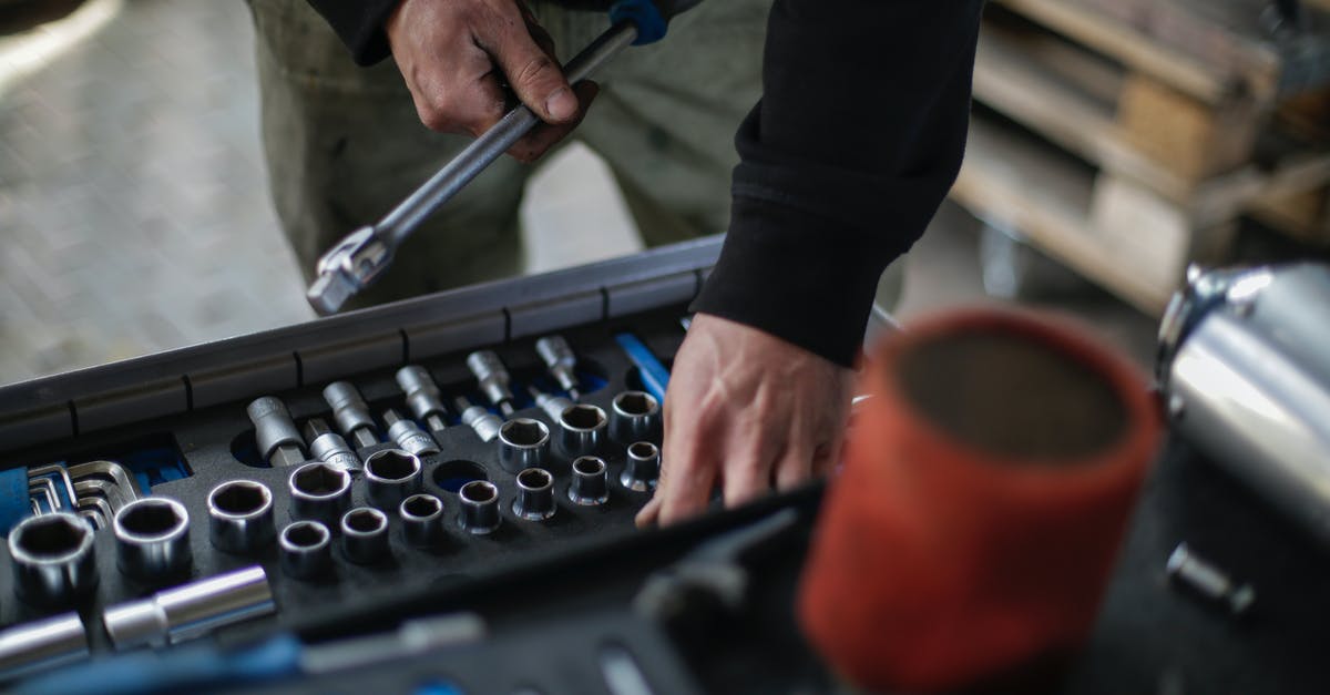 How to choose the right diameter size of saucepans? - Crop mechanic choosing metal tools for repair in garage How to choose the right diameter size of saucepans? - Crop mechanic choosing metal tools for repair in garage