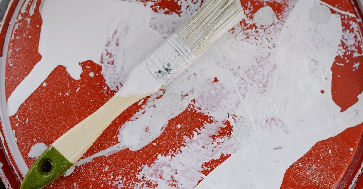 how to clean ginger residue from my plastic juicer containers? - From above of brush with white paint on dirty plastic surface during repair how to clean ginger residue from my plastic juicer containers? - From above of brush with white paint on dirty plastic surface during repair