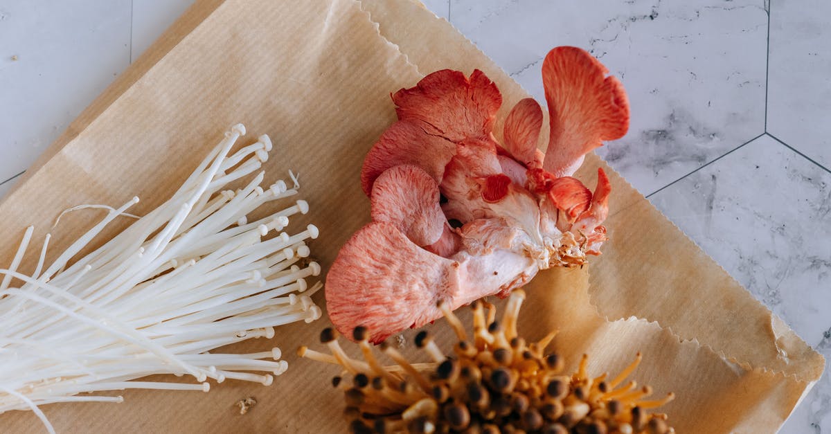 How to clean mushrooms? - Pink oyster nameko and enoki mushrooms on paper bag How to clean mushrooms? - Pink oyster nameko and enoki mushrooms on paper bag