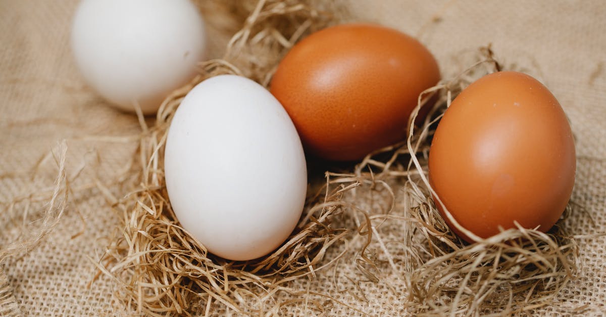 How to clean scrambled eggs from a pan? - Chicken eggs among straw on table How to clean scrambled eggs from a pan? - Chicken eggs among straw on table