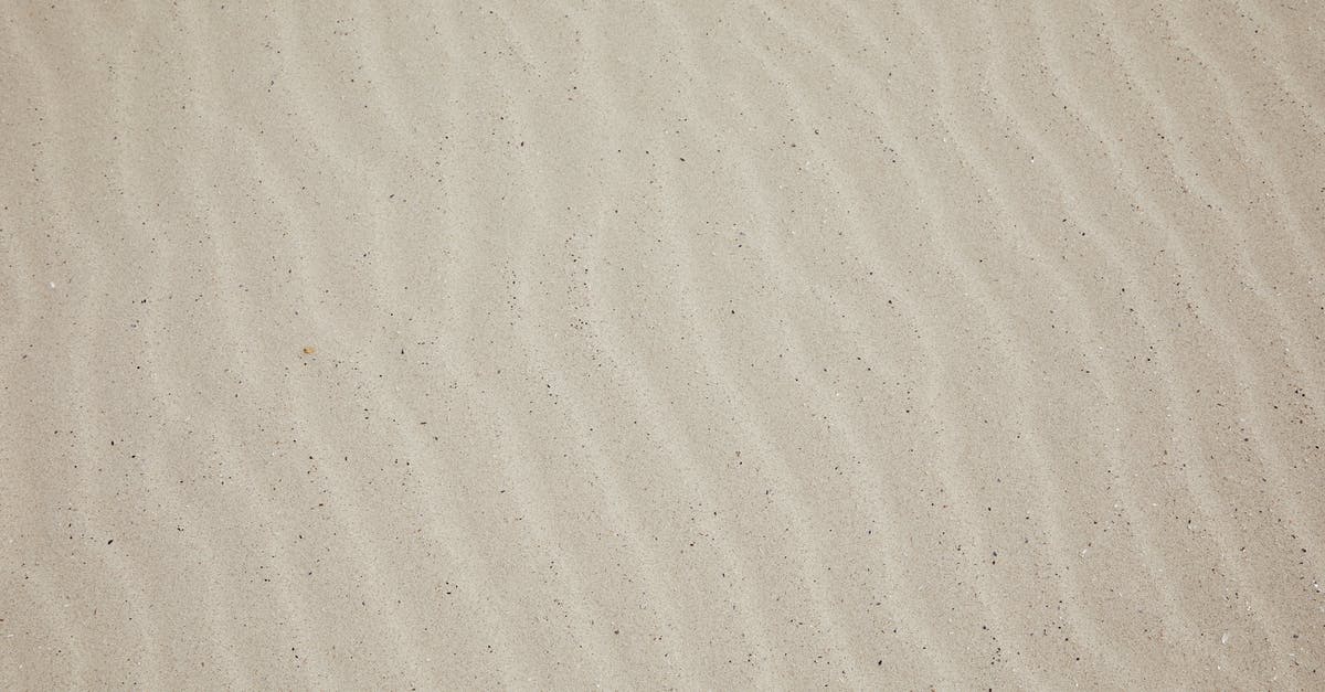 How to cleanly cover the dough while it rise? - Top view of empty dry plain surface of beach covered with sand in daytime