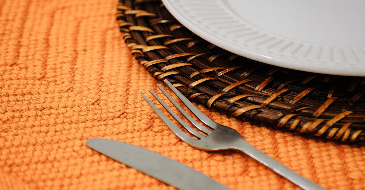 How to convert knife edge angle "ratios" into degrees? - Closeup of fork and knife on orange tablecloth with ornament under round plate on wicker mat How to convert knife edge angle "ratios" into degrees? - Closeup of fork and knife on orange tablecloth with ornament under round plate on wicker mat
