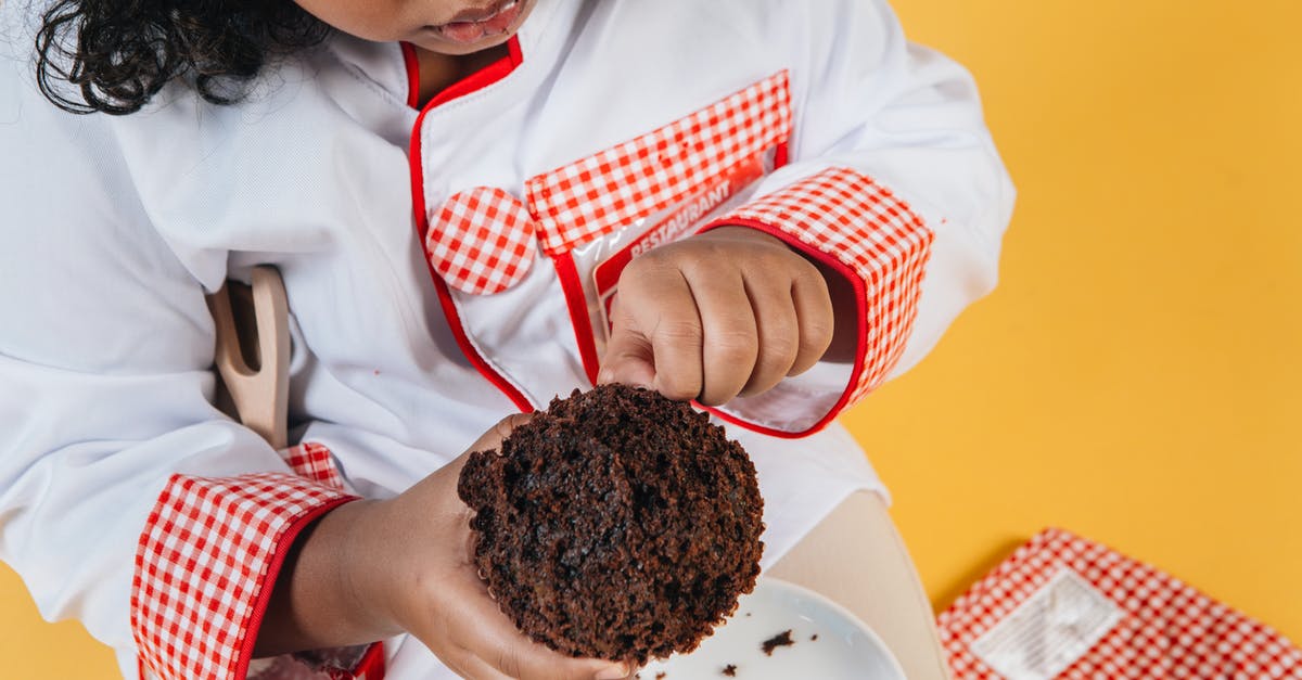 How to cook a tender quail? - From above of crop attentive African American girl in chef uniform preparing delicious chocolate treat above saucer How to cook a tender quail? - From above of crop attentive African American girl in chef uniform preparing delicious chocolate treat above saucer