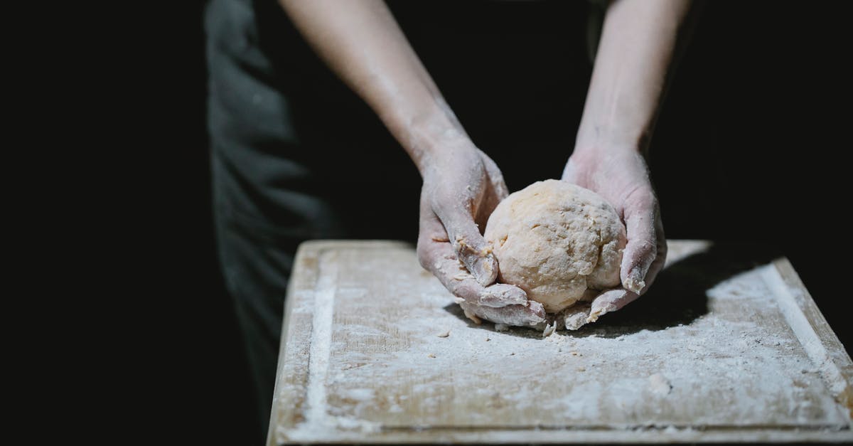 How to cook the food such that no acrylamide is formed? - From above of crop anonymous cook kneading dough on wooden board with flour How to cook the food such that no acrylamide is formed? - From above of crop anonymous cook kneading dough on wooden board with flour
