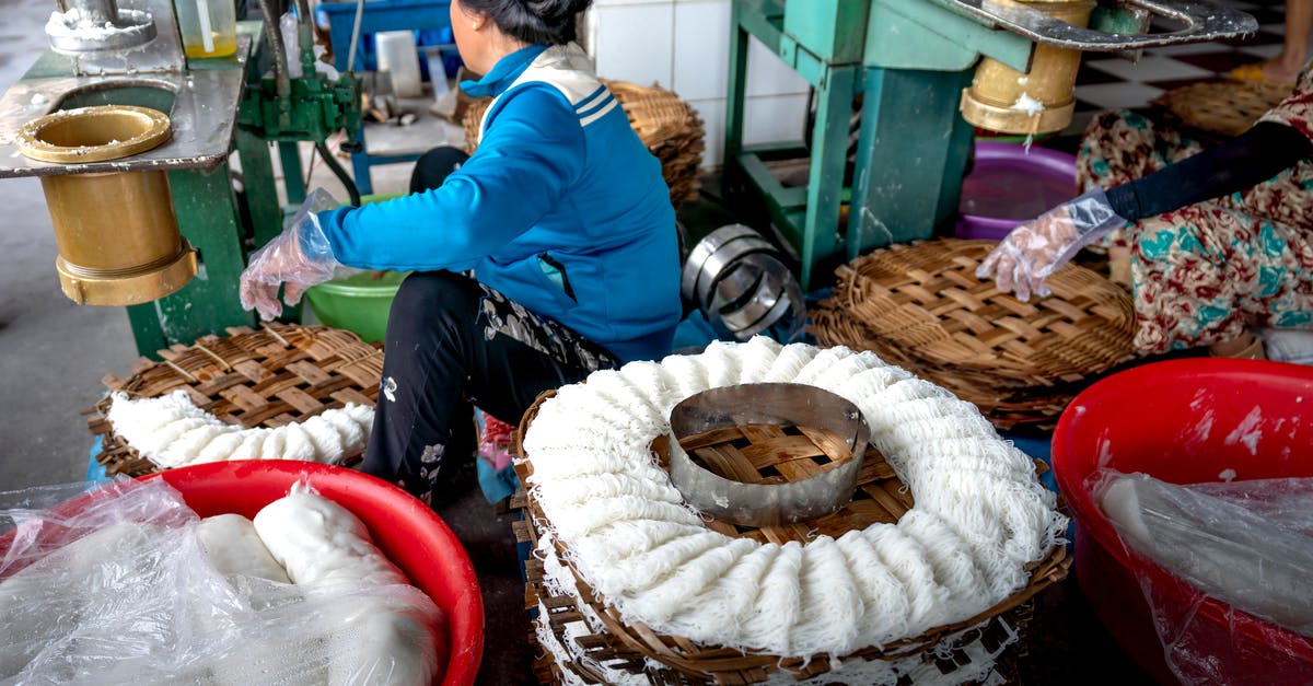 How to create the best veg noodles? - Faceless ladies making noodle in factory on machines How to create the best veg noodles? - Faceless ladies making noodle in factory on machines