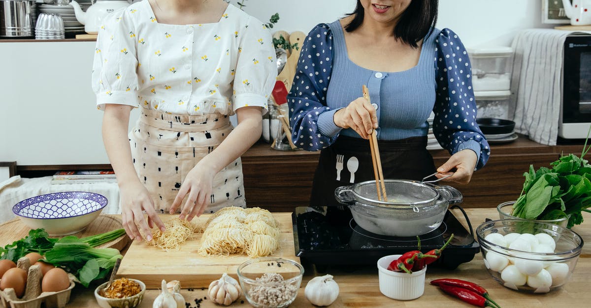 How to dehydrate chili at home? - Crop women cooking noodles in kitchen How to dehydrate chili at home? - Crop women cooking noodles in kitchen