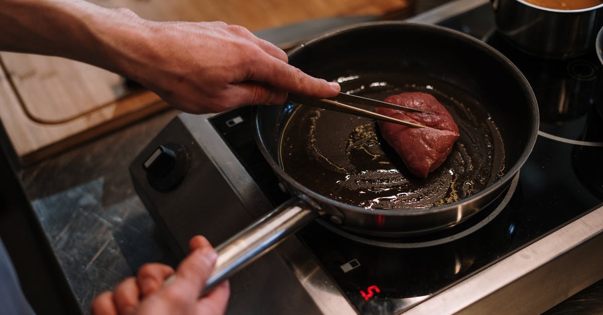 How to determine perfect pan temperature for steak? - Person Cooking on Black Pan How to determine perfect pan temperature for steak? - Person Cooking on Black Pan