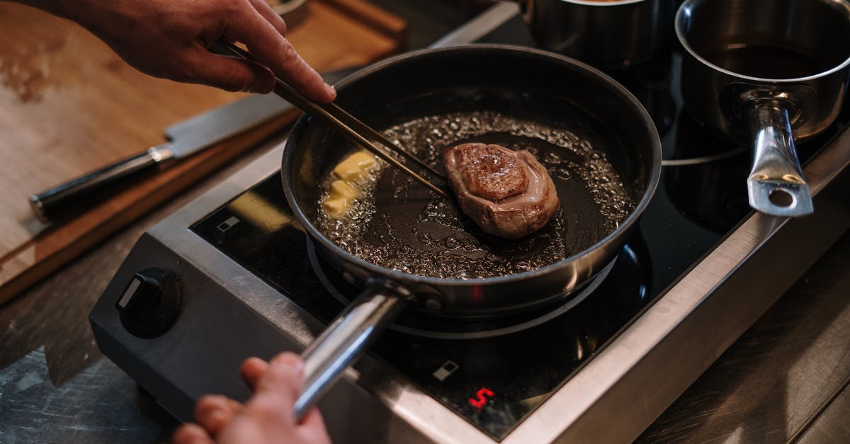 How to determine perfect pan temperature for steak? - Person Cooking on Black Frying Pan How to determine perfect pan temperature for steak? - Person Cooking on Black Frying Pan
