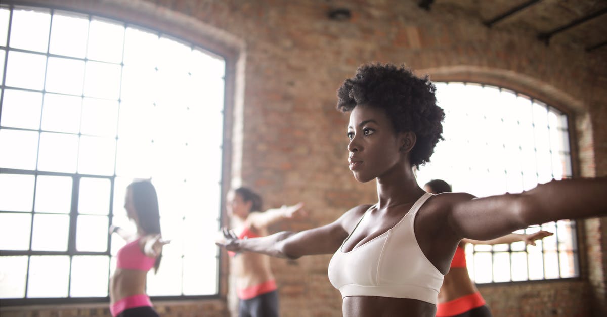 How to determine the "doneness" of salmon? - Confident fit ethnic woman training with other sportswomen in modern fitness studio