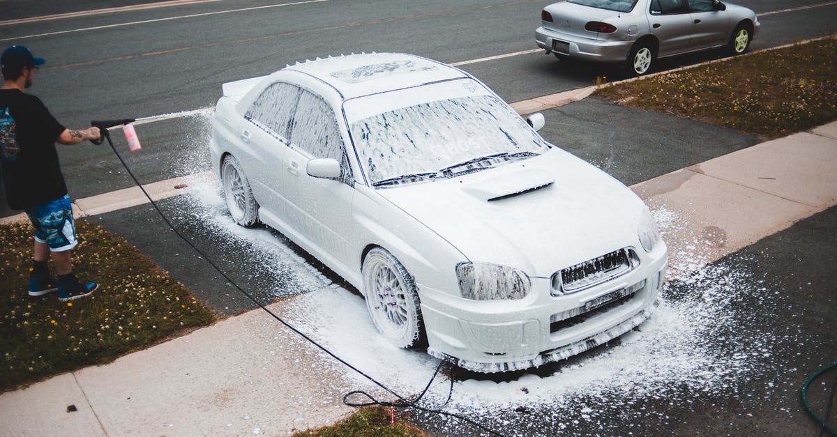 how to disarm a potentially pressurized whipping siphon? - Male driver washing car with power washer how to disarm a potentially pressurized whipping siphon? - Male driver washing car with power washer