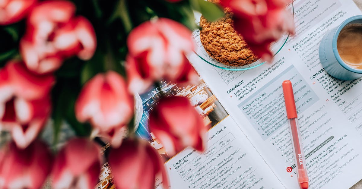 How to do English breakfast at home - From above bouquet of tulips placed near cookies and mug of coffee on English textbook on table How to do English breakfast at home - From above bouquet of tulips placed near cookies and mug of coffee on English textbook on table