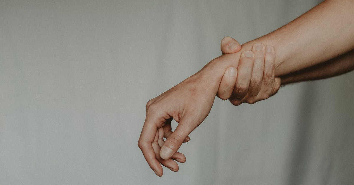 How to efficiently squeeze lemons by hand? - Unrecognizable person holding hand of partner abusively