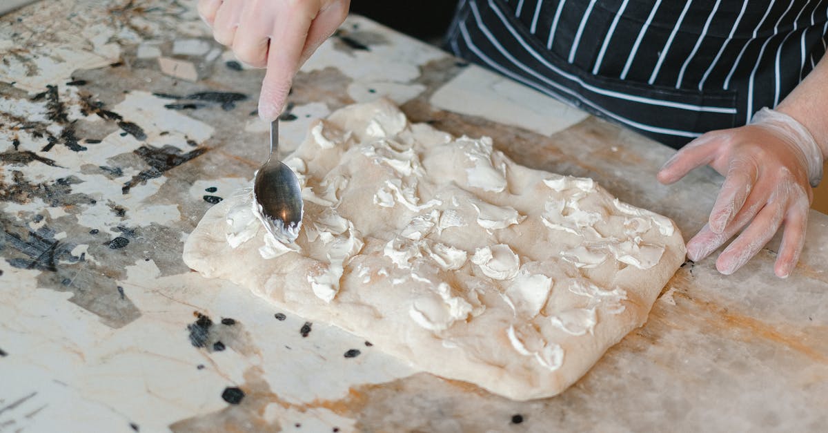 How to evenly spread butter in each square of a waffle? - A Chef Spreading Cheese over a Dough How to evenly spread butter in each square of a waffle? - A Chef Spreading Cheese over a Dough