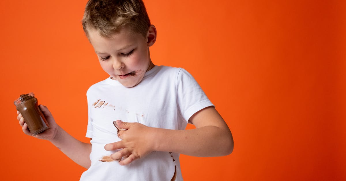 How to fix oily modeling chocolate - Boy in White Crew Neck T-shirt Holding Chocolate Jar How to fix oily modeling chocolate - Boy in White Crew Neck T-shirt Holding Chocolate Jar