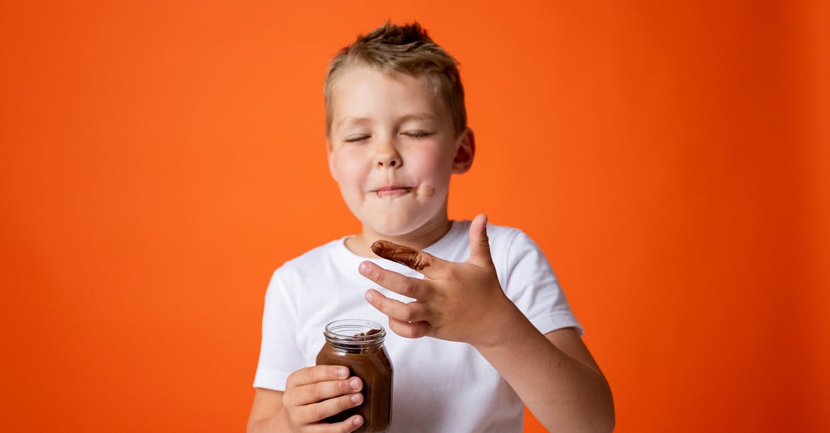How to fix oily modeling chocolate - Boy in White Crew Neck T-shirt Holding Chocolate Jar How to fix oily modeling chocolate - Boy in White Crew Neck T-shirt Holding Chocolate Jar