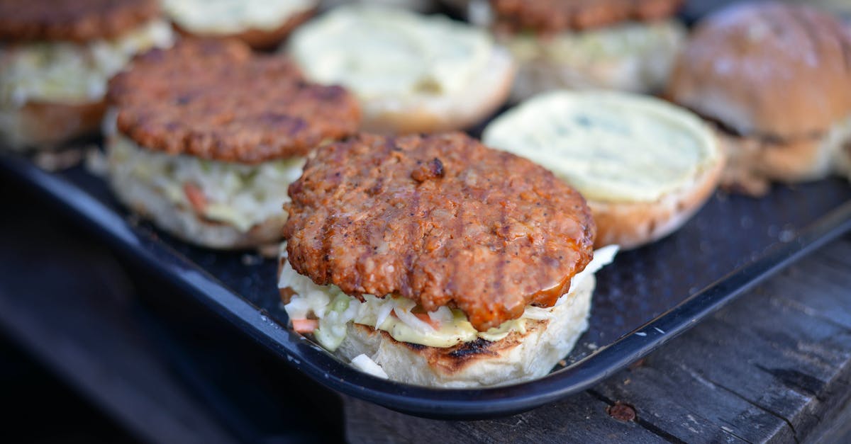 How to fry crispy bananas? - Grilled burgers placed on salver on wooden table How to fry crispy bananas? - Grilled burgers placed on salver on wooden table