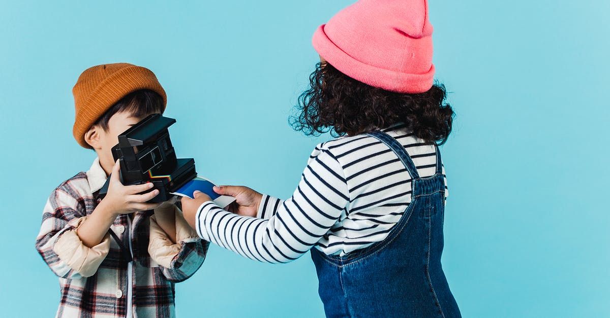How to get instant pudding to come out smooth? - Children taking instant photo on vintage camera in studio How to get instant pudding to come out smooth? - Children taking instant photo on vintage camera in studio
