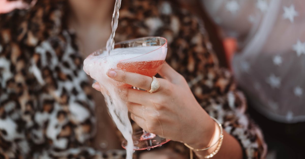 How to get rid of foam on shaken cocktails - Woman Holding Clear Drinking Glass With Red Liquid How to get rid of foam on shaken cocktails - Woman Holding Clear Drinking Glass With Red Liquid