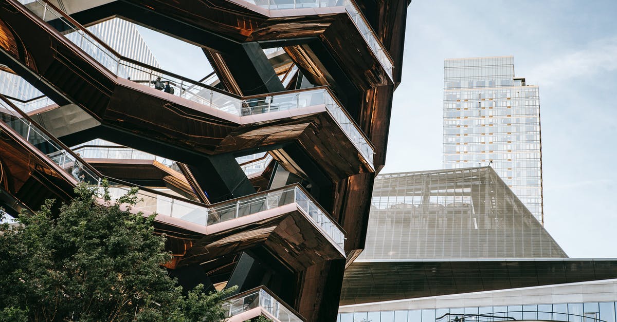 How to get the texture of commercial ketchup? - Low angle of futuristic geometric construction with stairs above bushes in city with skyscrapers in daylight How to get the texture of commercial ketchup? - Low angle of futuristic geometric construction with stairs above bushes in city with skyscrapers in daylight