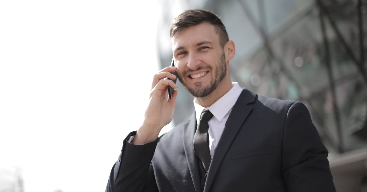 How to get those professional looking peaks on top of tiramisu? - Man in Black Suit Jacket Holding Smartphone How to get those professional looking peaks on top of tiramisu? - Man in Black Suit Jacket Holding Smartphone