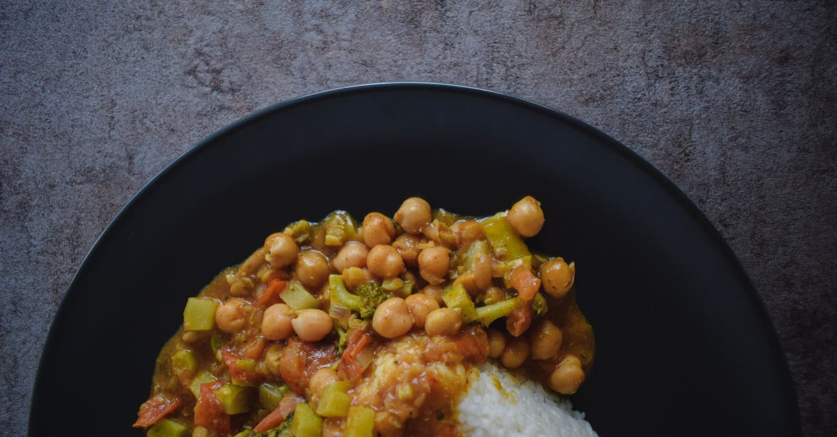 How to get very smooth, flat cooked potato pieces - Tasty rice with stewed vegetables on plate How to get very smooth, flat cooked potato pieces - Tasty rice with stewed vegetables on plate
