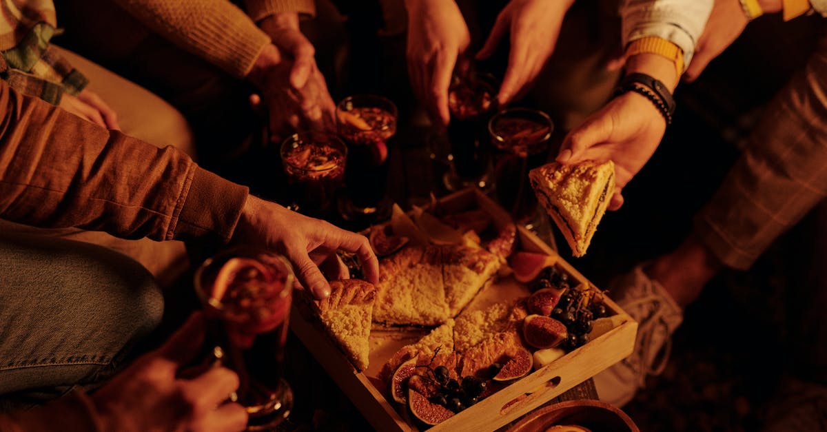How to incorporate alcohol (rum) into a cake recipe? - From above faceless people sharing delicious pie with sweet snacks and mulled wine enjoying night in garden How to incorporate alcohol (rum) into a cake recipe? - From above faceless people sharing delicious pie with sweet snacks and mulled wine enjoying night in garden